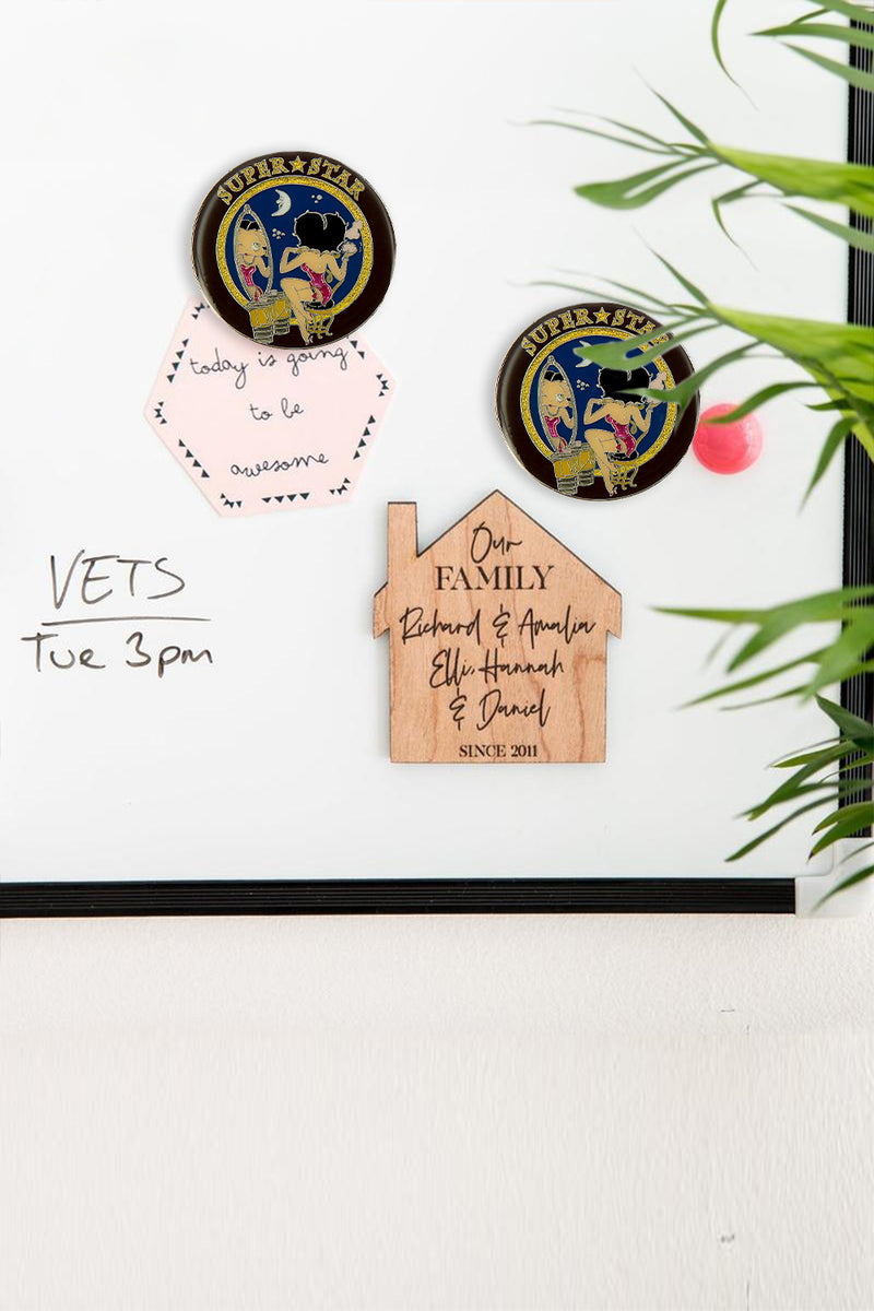 Betty Boop Fridge Magnet Superstar Betty is wearing a bright pink dress and sitting on a stool and looking at the mirror and superstar written on top. This fridge magnet sticks easily to the fridge or any other magnetic surface where magnets can stick to.  Exclusively Available at Reliance Gifts www.reliancegifts.co.uk