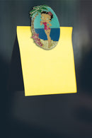 Betty Boop Fridge Magnet Paradise Betty is posing in a pink dress with a blue background. This fridge magnet sticks easily to the fridge or any other magnetic surface where magnets can stick to. Betty Boop Paradise fridge magnet has a fine quality craftsmanship. Exclusively Available at Reliance Gifts www.reliancegifts.co.uk 