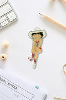 Betty Boop Fridge Magnet Cowgirl Betty is in a pink dress and posing with a guitar.This fridge magnet sticks easily to the fridge or any other magnetic surface where magnets can stick to. Betty Boop Cowgirl fridge magnet has a fine quality craftsmanship. Exclusively Available at Reliance Gifts www.reliancegifts.co.uk