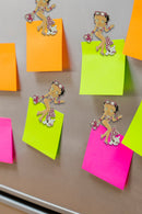 Betty Boop Fridge Magnet Beach Babe Betty is in a flowery beach wear in pink and white posing with her pet pudgy. This fridge magnet sticks easily to the fridge or any other magnetic surface where magnets can stick to. Exclusively Available at Reliance Gifts www.reliancegifts.co.uk