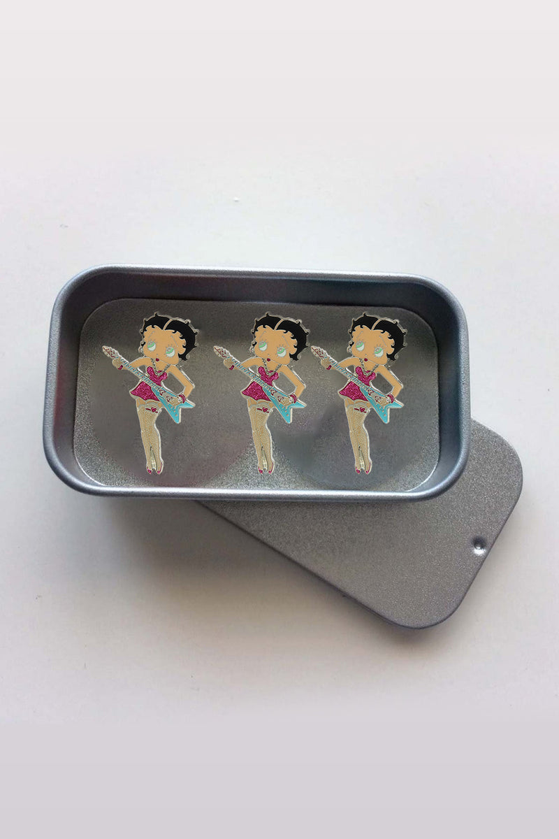 Betty Boop Fridge Magnet Rock Chick Betty is in a pink dress and posing with a guitar. This fridge magnet sticks easily to the fridge or any other magnetic surface.Betty Boop Rock Chic fridge magnet has a fine quality craftsmanship. Exclusively Available at Reliance Gifts www.reliancegifts.co.uk