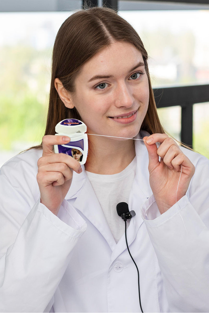 Justin Bieber Mint Floss  is white and purple colour which is designed in USA .It is a Bieber mint floss must to keep your Bieber smile look great. Justin Bieber floss contains 55 yards of waxed, mint flavoured dental floss, styled after the sensational young star Justin Bieber.