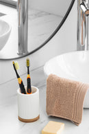 Justin Bieber Sonic Toothbrush. It is battery-operated, powering more than 30,000 brush strokes per minute. The bristles are designed for junior or adult teeth. Soft Dupont bristles and an ergonomic design help clean plaque.Easily Replaceable Brush Head and includes a tongue and cheek cleaner.