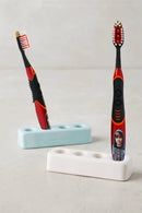 Justin Bieber Sonic Toothbrush -Red looks great with a cute picture of Justin Bieber on the handle looking back at you. Easily Replaceable Brush Head includes a tongue and cheek cleaner. 2 buttons = on and off on the brush handle. It has a replaceable AAA battery is included and easy to replace.